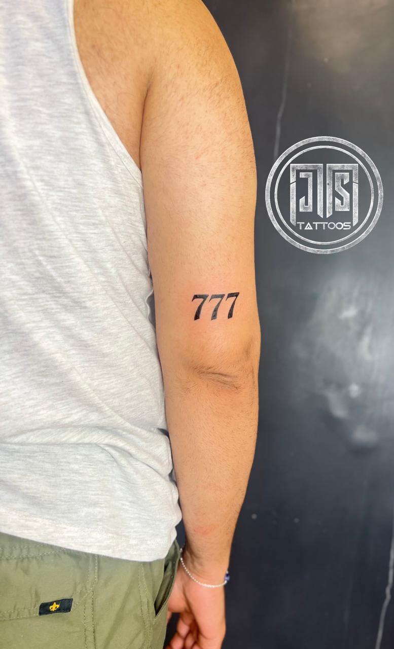 777 symbol tattoo Paschim Vihar